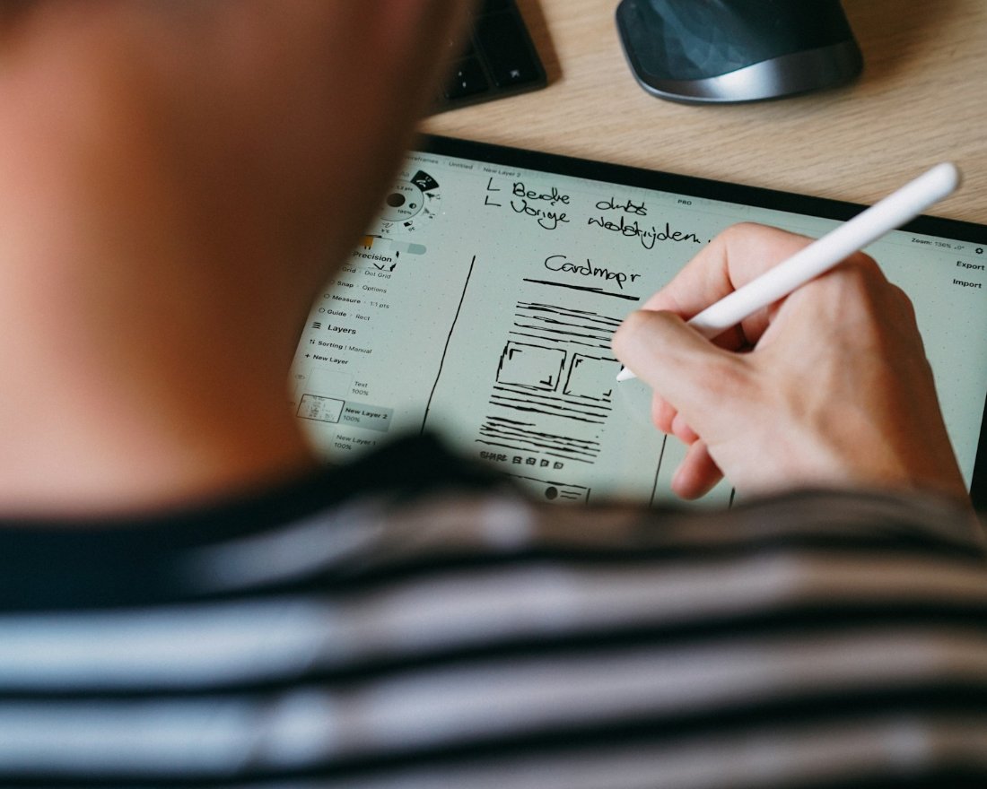 Hand sketching web application wireframes