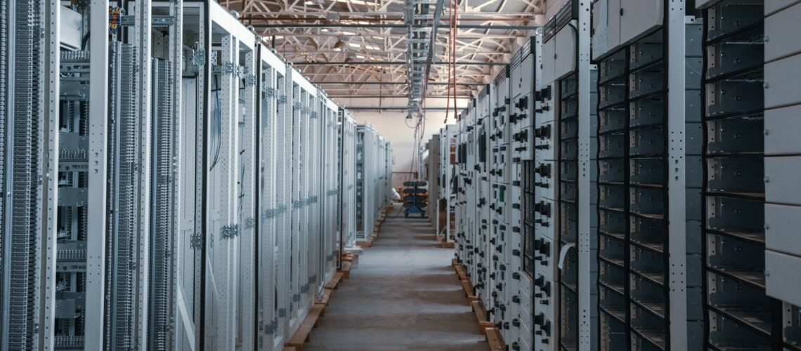 Data centre aisle lined with server racks