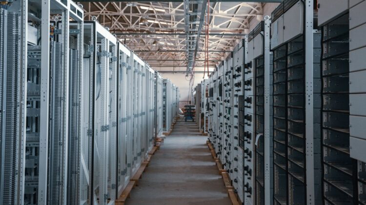 Data centre aisle lined with server racks